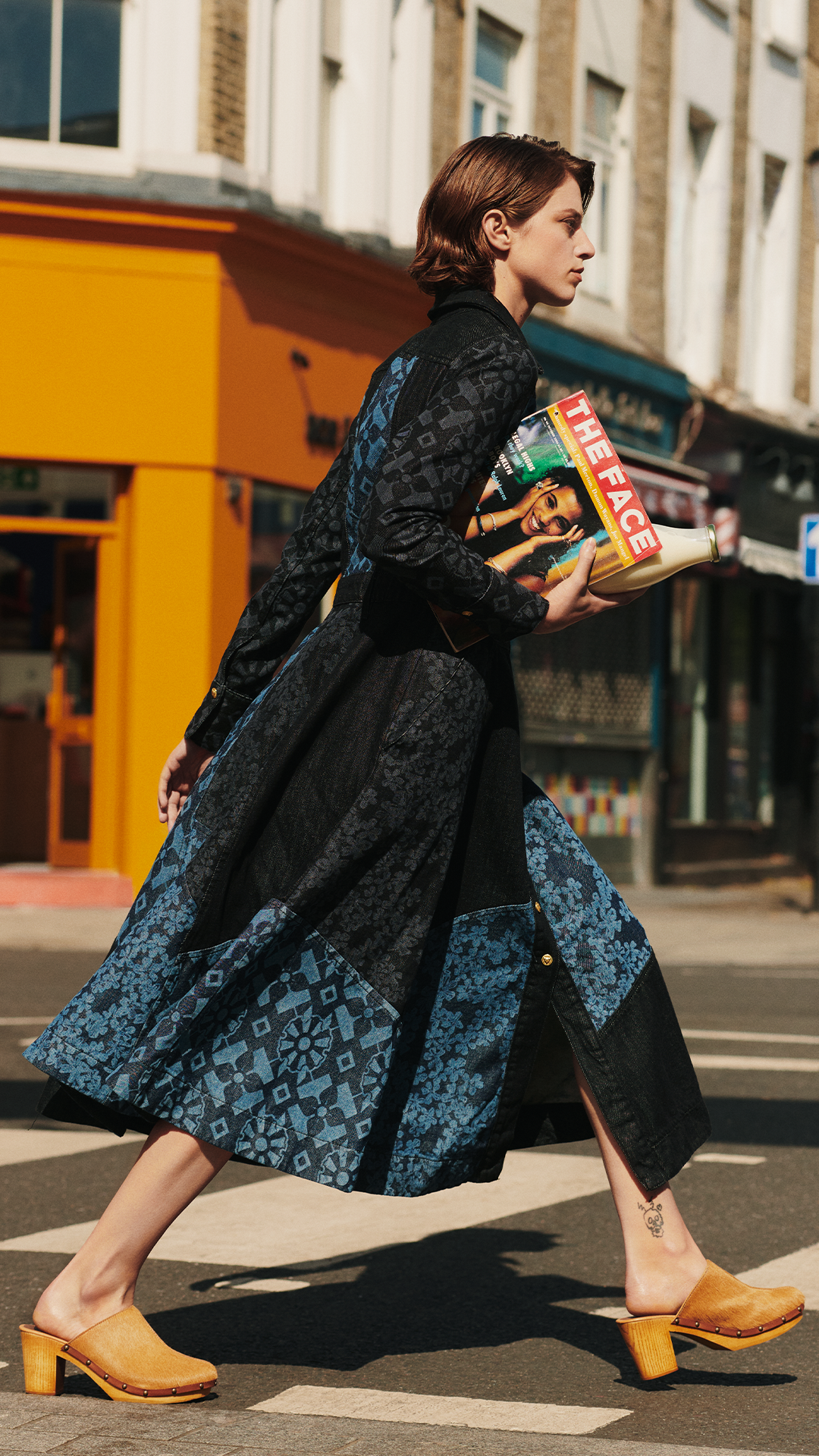 model wears hayley menzies denim dress in portobello road
